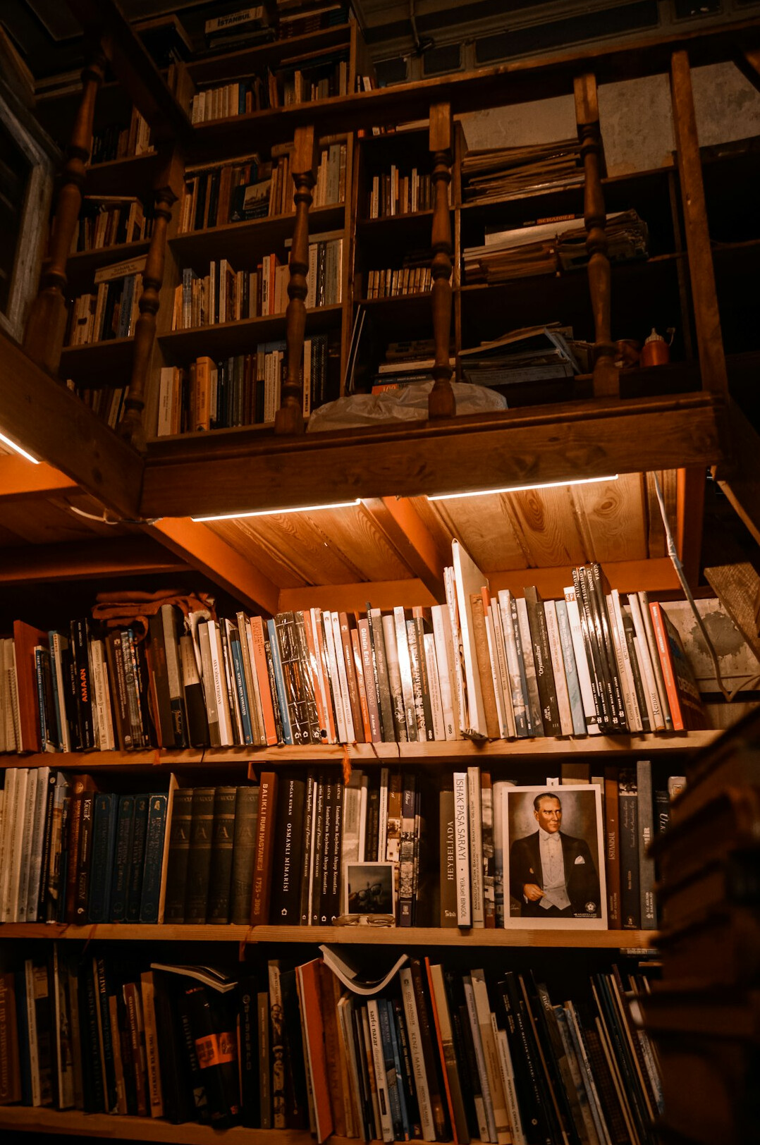 Atmospheric old library with tall wooden shelves and warm light