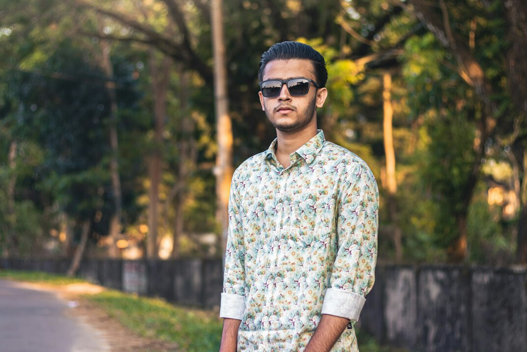 Portrait of a man with short hair in a casual shirt