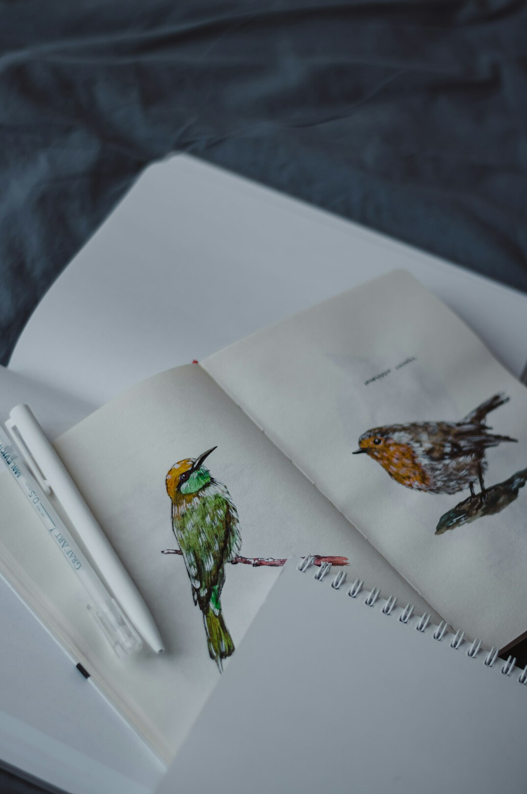 Notebook and pen on a wooden desk